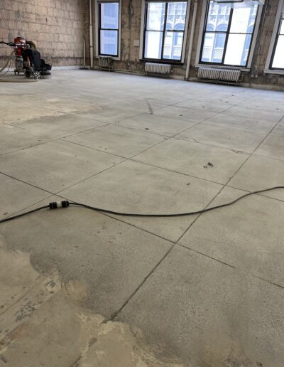 An empty room with a hose on the floor