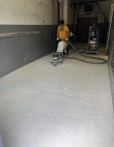 A man in a yellow shirt is using a machine