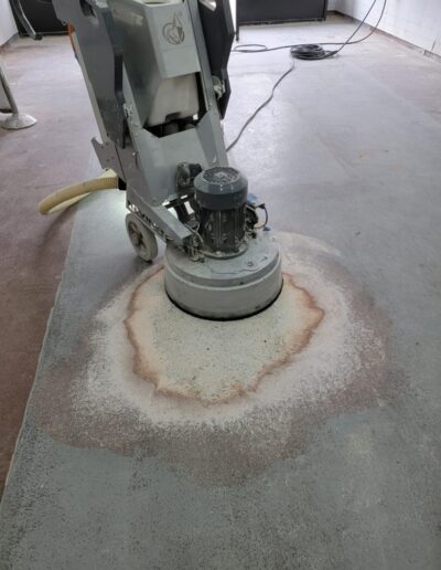 A concrete floor with a machine on top of it